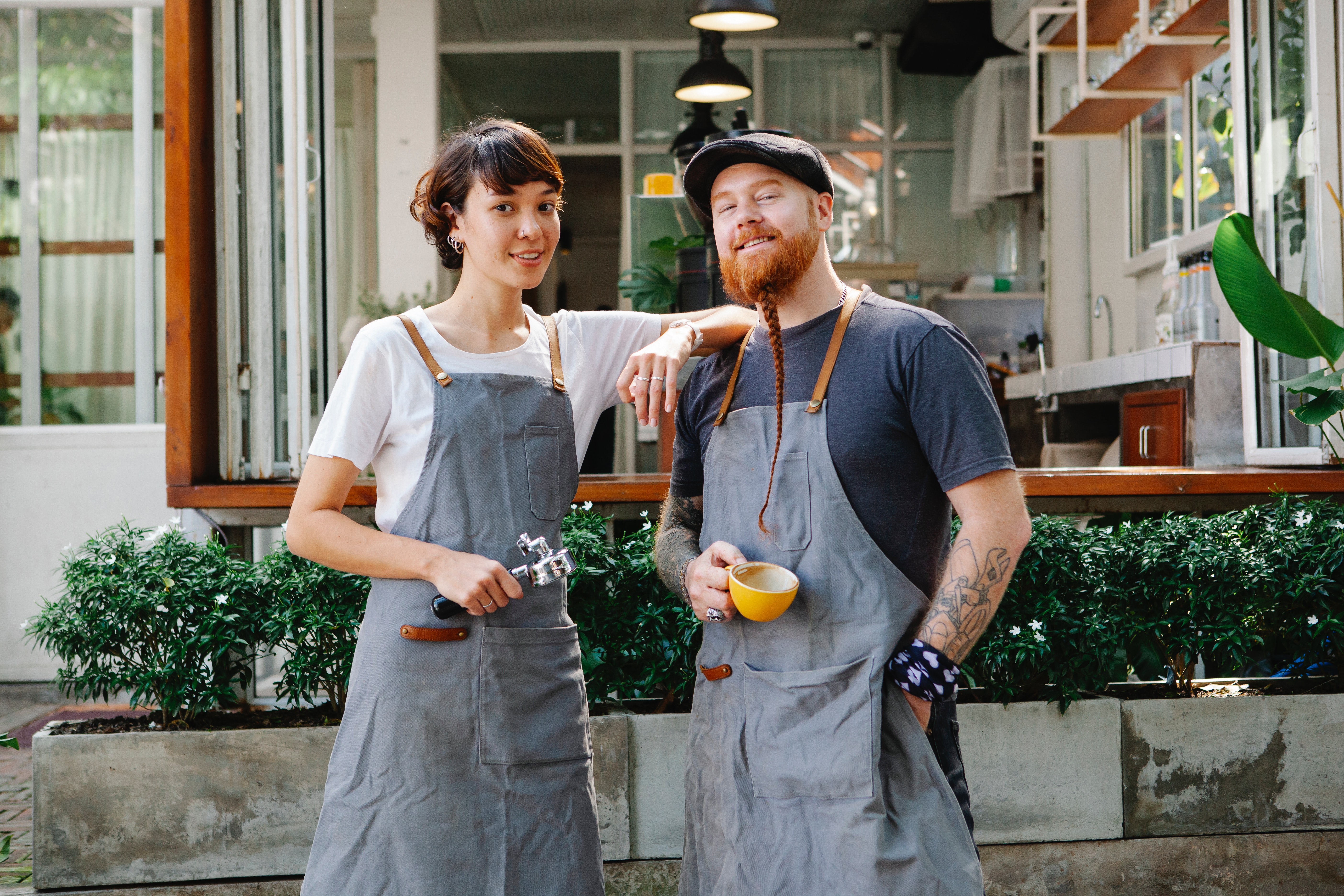 Owners of Blended Cafe, posing for a picture outside the cafe.